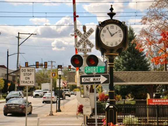 Image of downtown Ambler, with train station and clock in the background