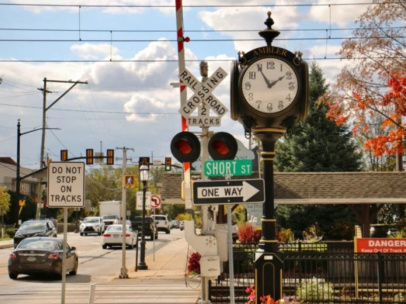 Image of downtown Ambler, with train station and clock in the background